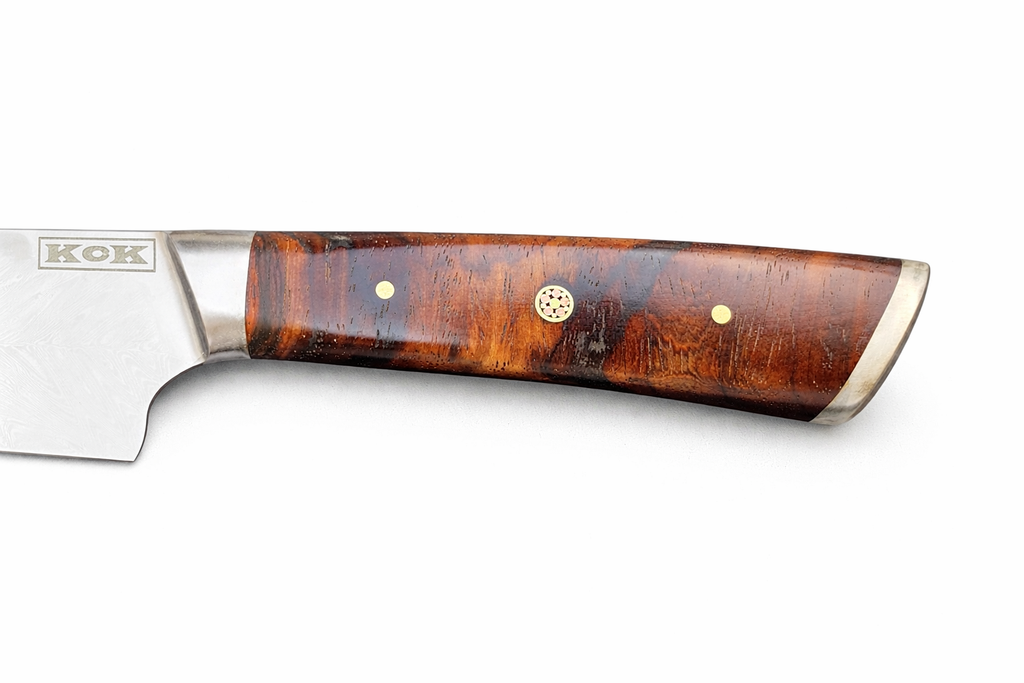 Kitchen knife with a wooden handle on a white background, featuring the brand 'KCK'.