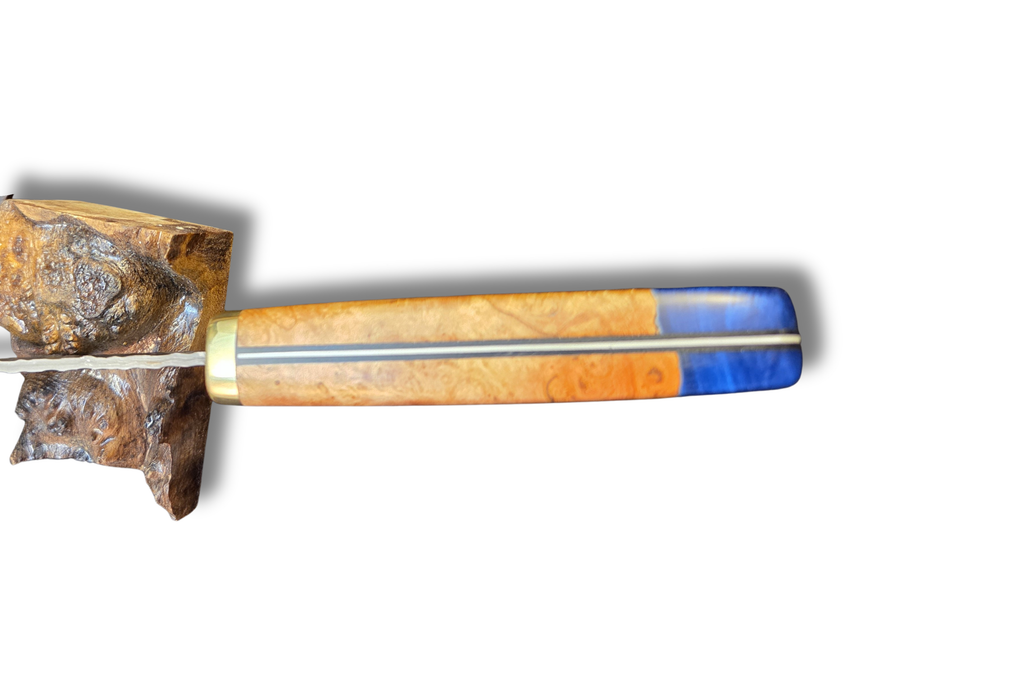 Petty knife handle made from cherry burl and blue resin on a white background