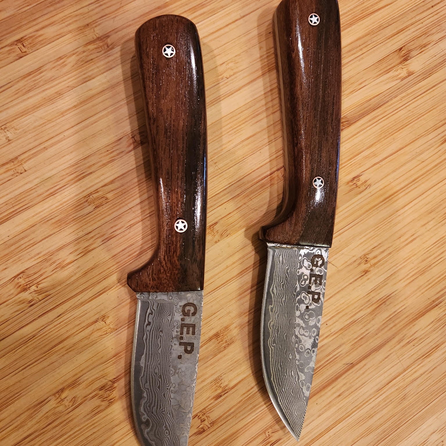 Two knives made from battleship wood